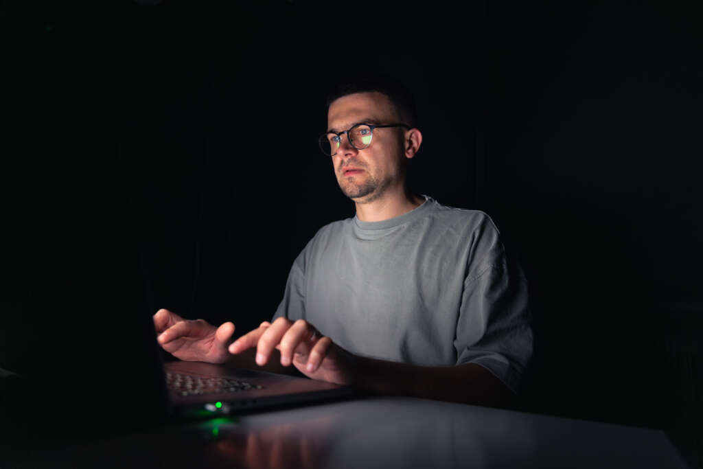 Person using a digital prayer platform on a smartphone to build a consistent daily prayer routine and strengthen spiritual devotion