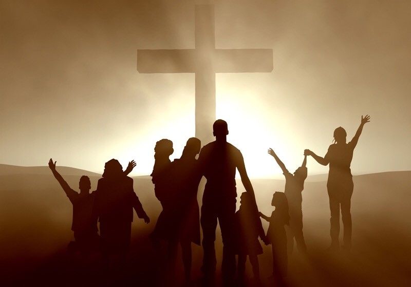 Group of people praying together