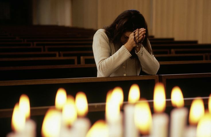 A person praying, building spiritual habit in a church