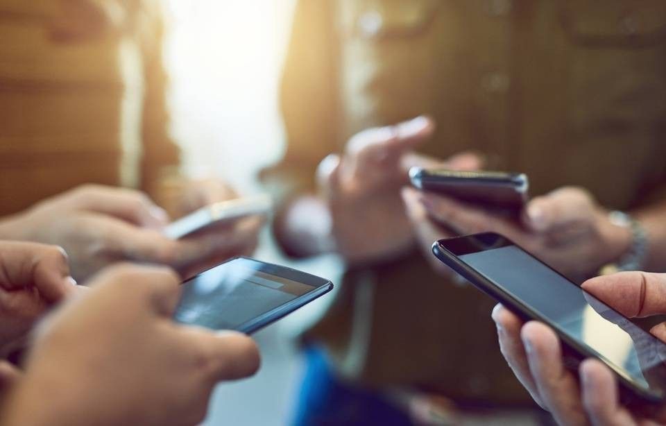 People gathering with handphone on each of their hands
